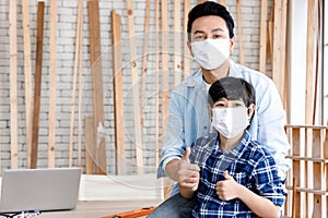 Father and son wearing medical mask.