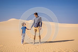 Father and son at the white desert. Traveling with children concept. Resumption of tourism after quarantine covid 19