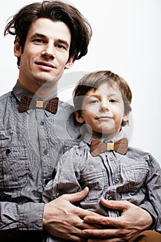 Father with son in wooden bowties on white