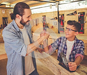 Father and son working with wood