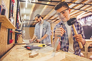 Father and son working with wood