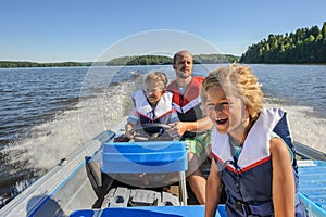 Father and sons boating