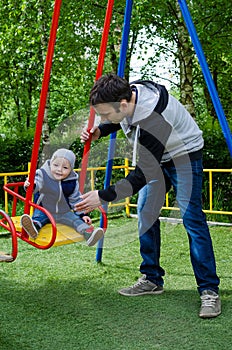 Father swinging his baby