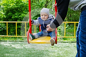 Father swinging his baby