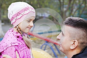 Father talking to daughter