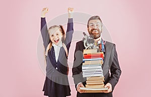 Father or teacher hold big stack school textbook notebook books. Happy excited preteen girl wears school uniform holding