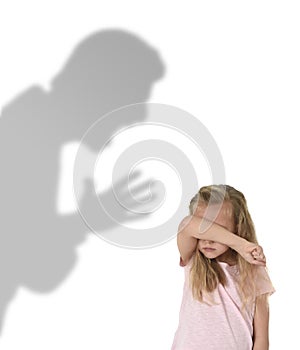 Father or teacher shadow screaming angry reproving young sweet little schoolgirl or daughter