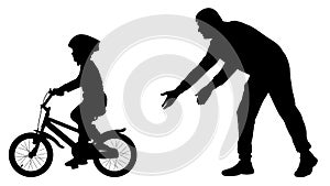 Father teaches baby to ride bicycle silhouette. First bike ride vector. Teaching a child to ride bike without stabilisers