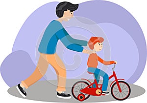 Father teaches son to ride a bike. Kid learns to ride bicycle. Parenting concept. Father help his boy kid learning to ride