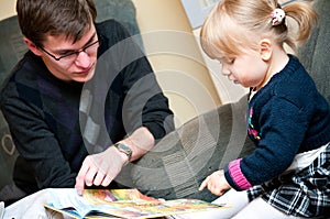 Father teaching daughter