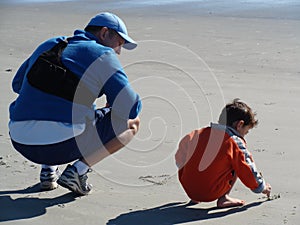 Father teaching his son to write