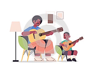 Father teaching little son to play the guitar parenting fatherhood concept dad spending time with kid