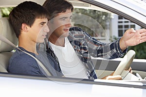 Father Teaching Teenage Son To Drive