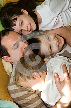 Father and three young sons photo