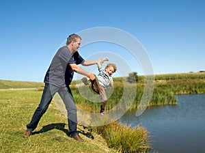 Father throwing Kid