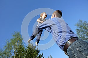 Father toss up a child