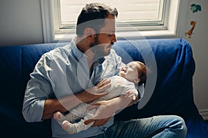 father trying to calm down pacify newborn baby