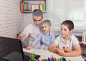 Father trying to talk with doctor on laptop whilekids staying home