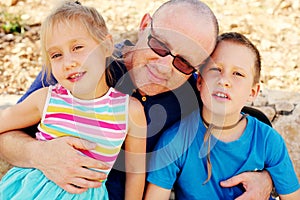 Father with two kids outdoors