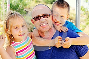 Father with two kids outdoors