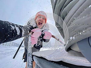 Father walking with his child through a snowy urban setting, emphasizing the joy and simplicity of a winter walk