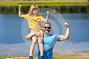 fatherhood support. strong friendship between father and son. son and father are strong together. strong father and son