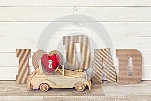 Fathers day background with wooden toy car and cardboard letters