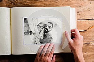 Fathers day concept. Photo album, black-and-white pictures.