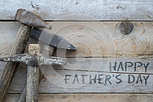 Fathers day concept, Wooden background with a hammer