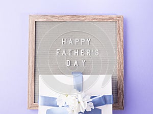 Fathers day purple greeting card with text on letter board