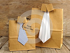 Fathers Day shirt and tie gift bags on a wood