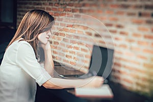 Fatigue Women Thinking alone while working