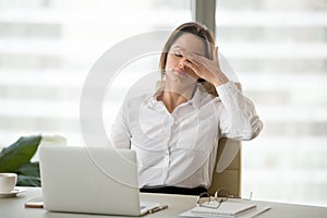 Fatigued tired businesswoman feeling exhausted of overwork in of photo