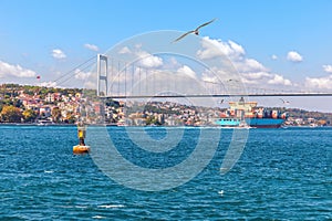 The Fatih Sultan Mehmet Bridge, the cargo ship and the Bosphorus view, Istanbul