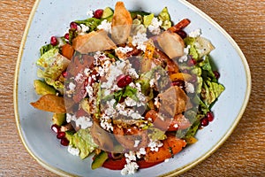 Fattoush is a Levantine salad made from toasted or fried pieces of khubz combined with mixed greens