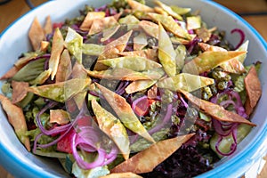 Fattoush salad in a bowl on the table