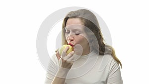 Fatty woman eating pear