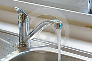 Faucet with a flowing water