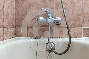 Faucet with lime deposit calcified water tiles fungi moisture problem