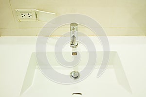 Faucet nearly plug outlet to dangerous