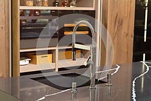 Faucet and sink in a modern, elegant kitchen