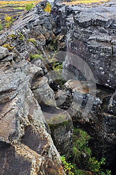 The fault that marks the continental separation in plate tectonics between Europe and America, above Grjotagja cave, Iceland.