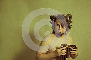 Faun with panflute photo
