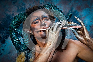 Faun playing the flute