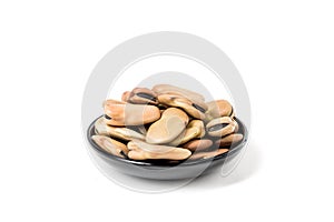 Fava beans in a bowl isolated over white background