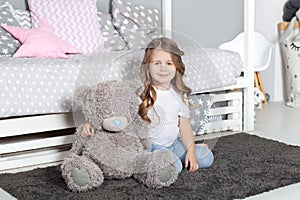 Favorite toy. Girl child sit on bed hug teddy bear in her bedroom. Kid prepare to go to bed. Pleasant time in cozy bedroom. Girl k