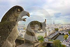Faymous gargoyles of Notre Dame over Paris