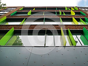 FaÃ§ade with modern green plex sun shade