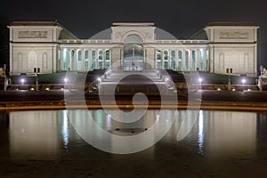 FaÃ§ade, stairways and fountain of the Legion of Honor at night.