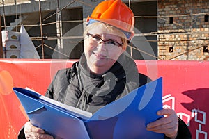 Feamle Engineer in the construction helmet photo